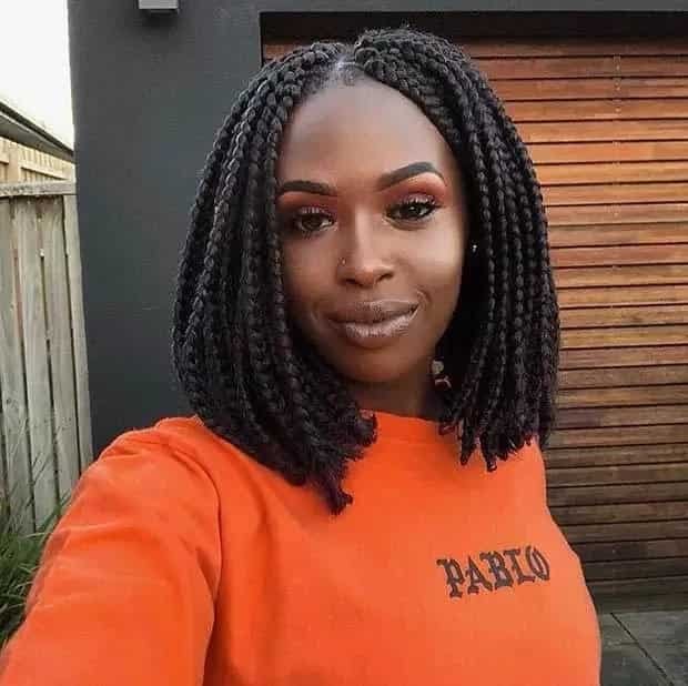 20 Ghana Weaving Styles You Should Try This Festive Season 24 Center-parted Short Braids