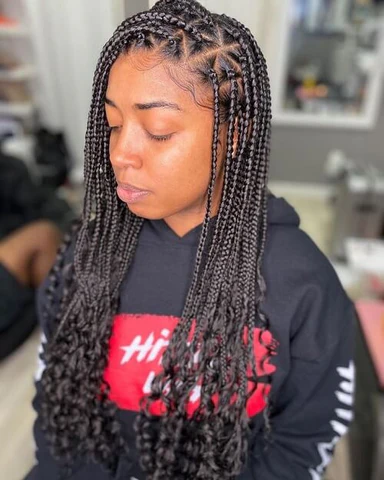 20 Ghana Weaving Styles You Should Try This Festive Season 27 Mid-sized Thick Braids with Multiple Partings