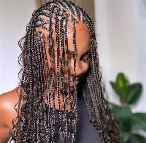 20 Ghana Weaving Styles You Should Try This Festive Season 16 Mixed-sized cornrows with Curly Hair Extension