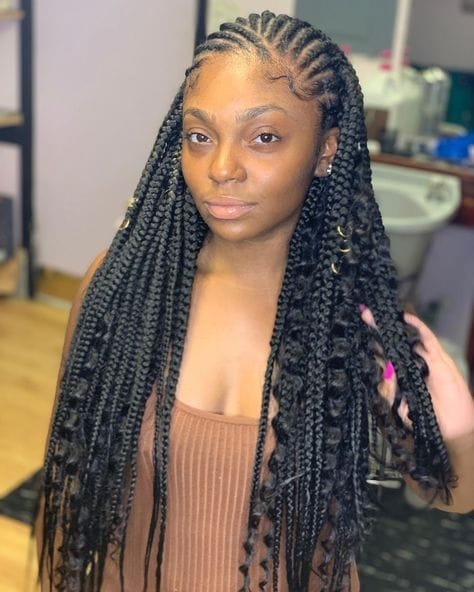 20 Ghana Weaving Styles You Should Try This Festive Season 17 Mixed-sized cornrows with Curly Hair Extension